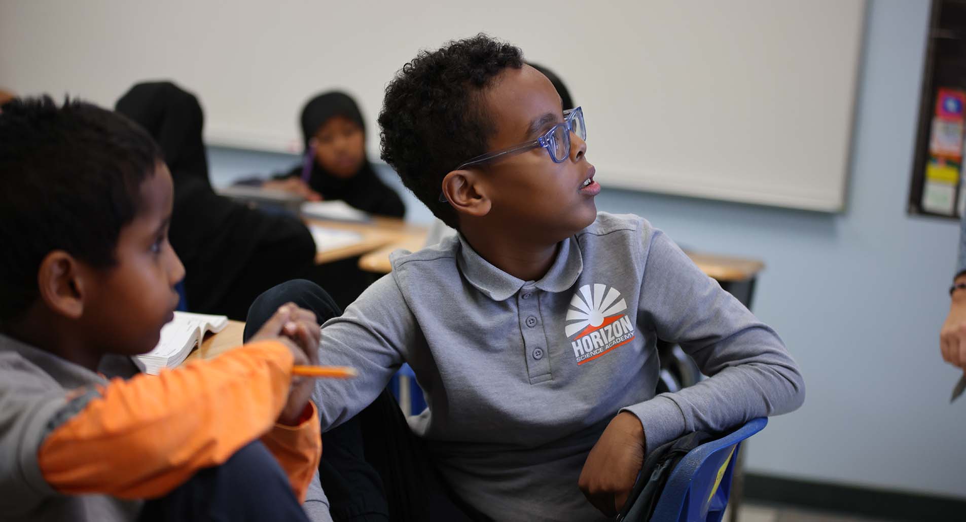 Teacher helping student