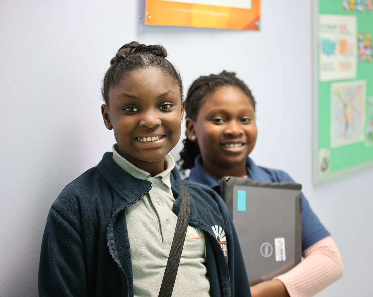 Teacher or school staff member warmly interacting with a student outside